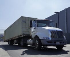 Truck delivering storage container