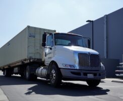 truck carrying a large storage container